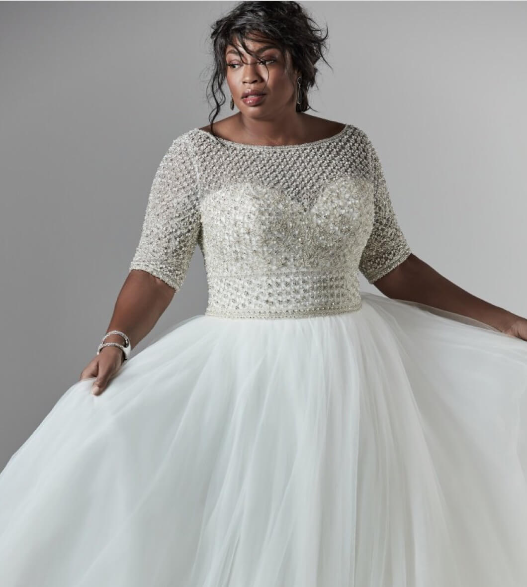 Model wearing white gown