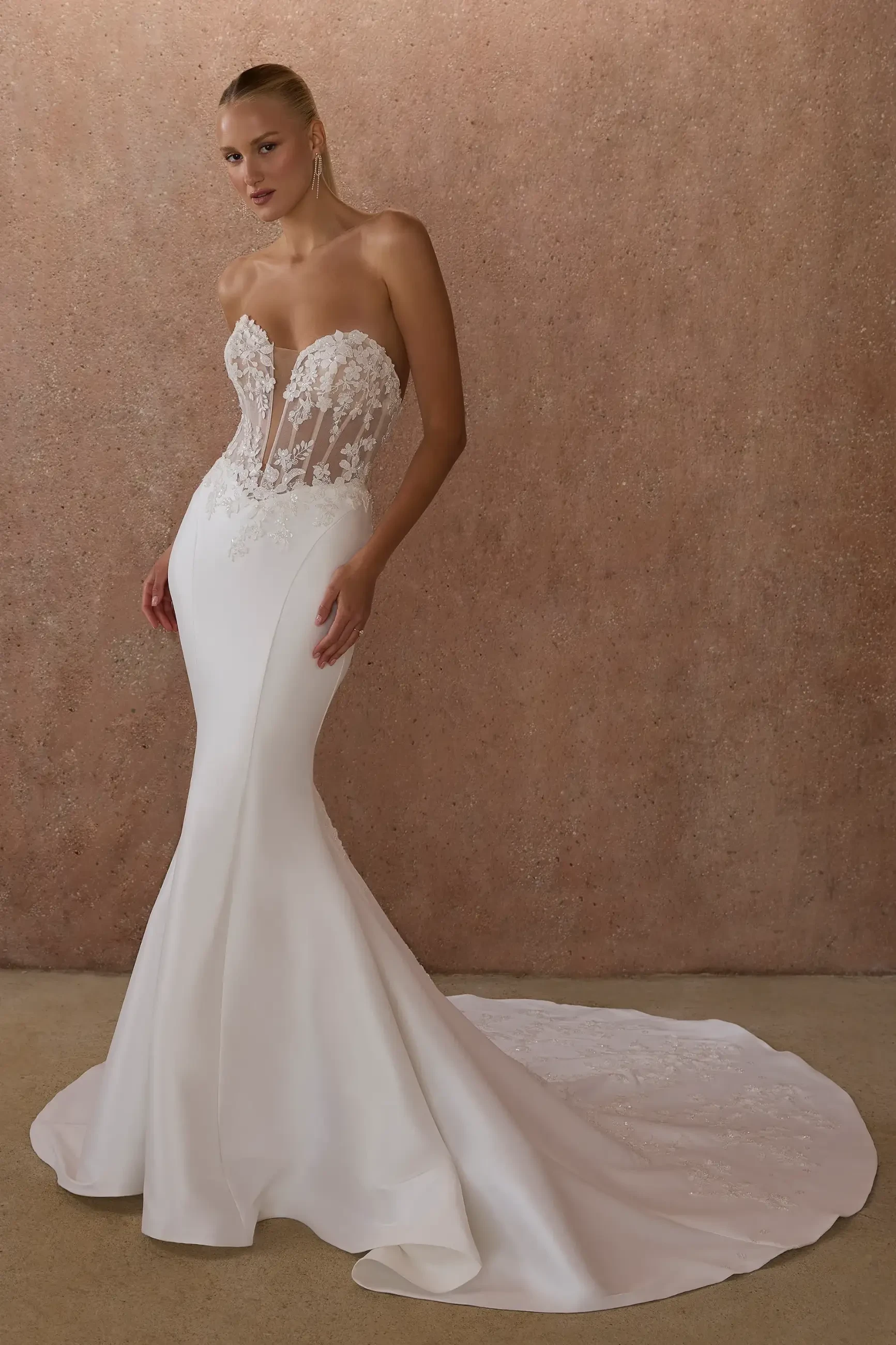 model is wearing a strapless bridal gown