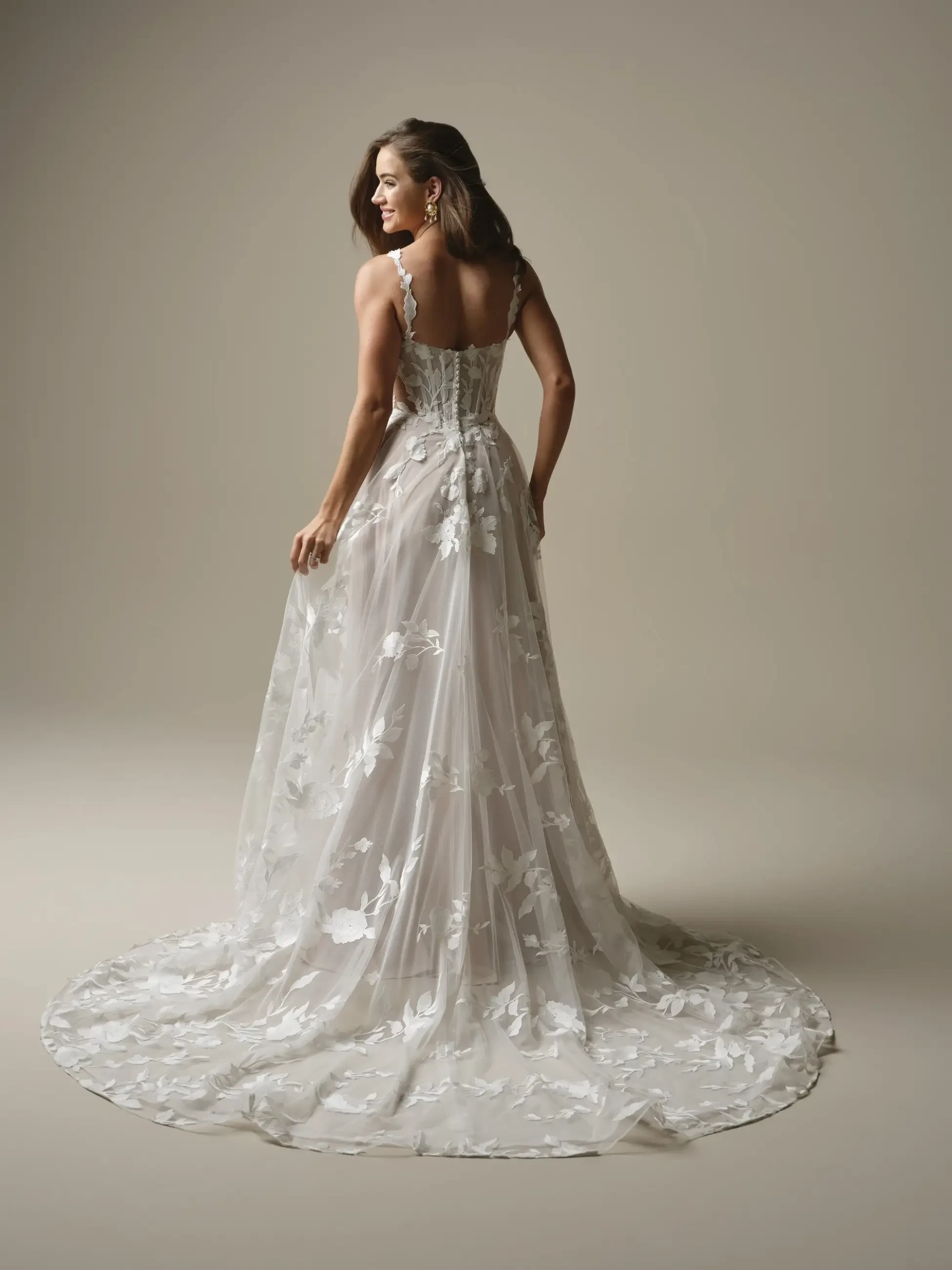 model is wearing a sleeveless a-line wedding dress