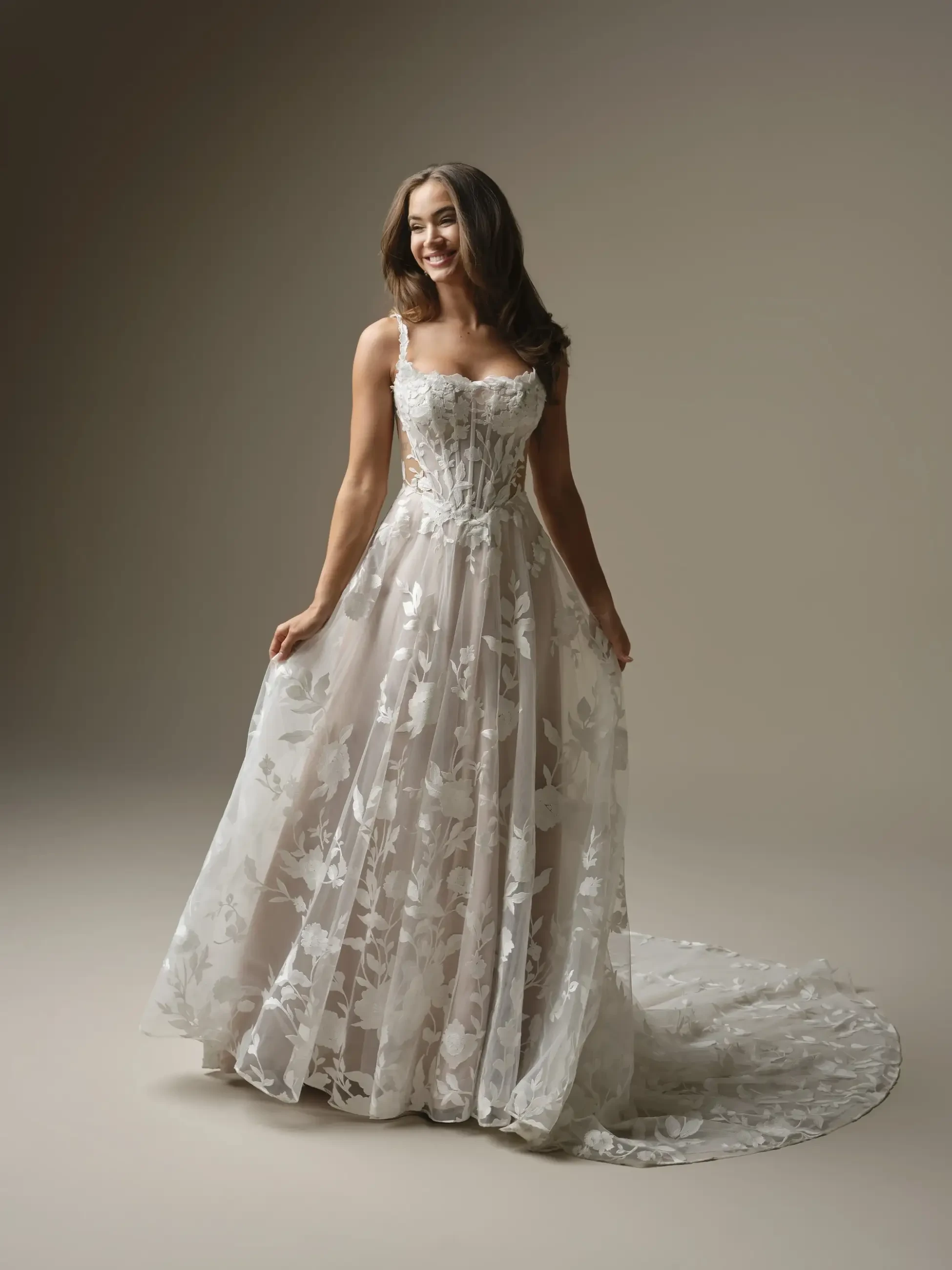 model is wearing a sleeveless a-line wedding dress