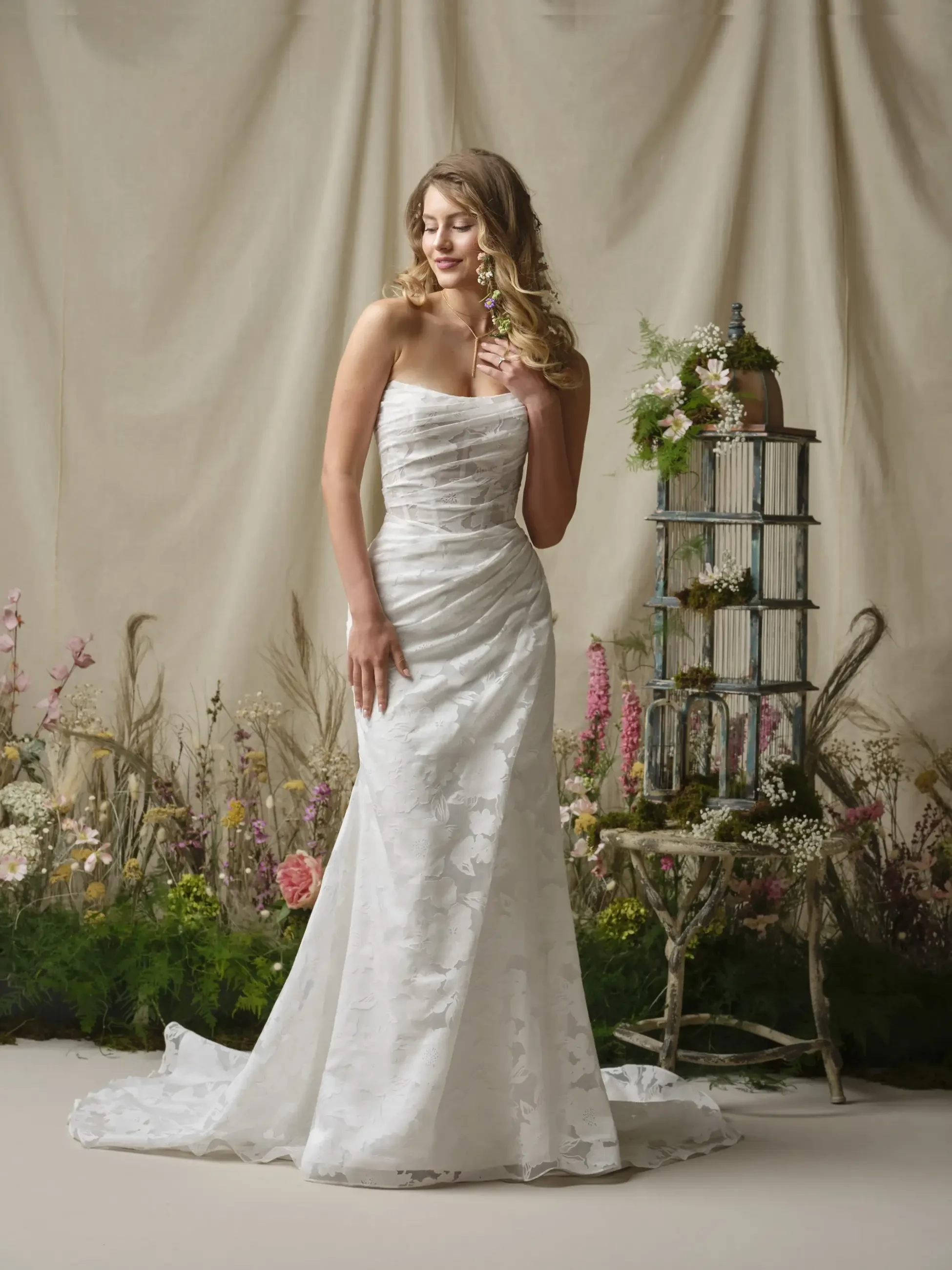 model is wearing a strapless wedding dress