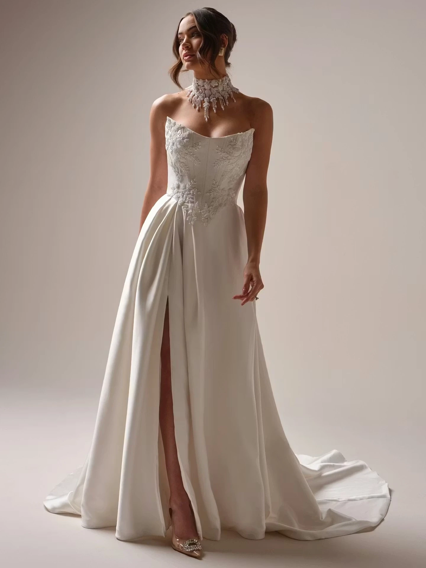 Model wearing white gown