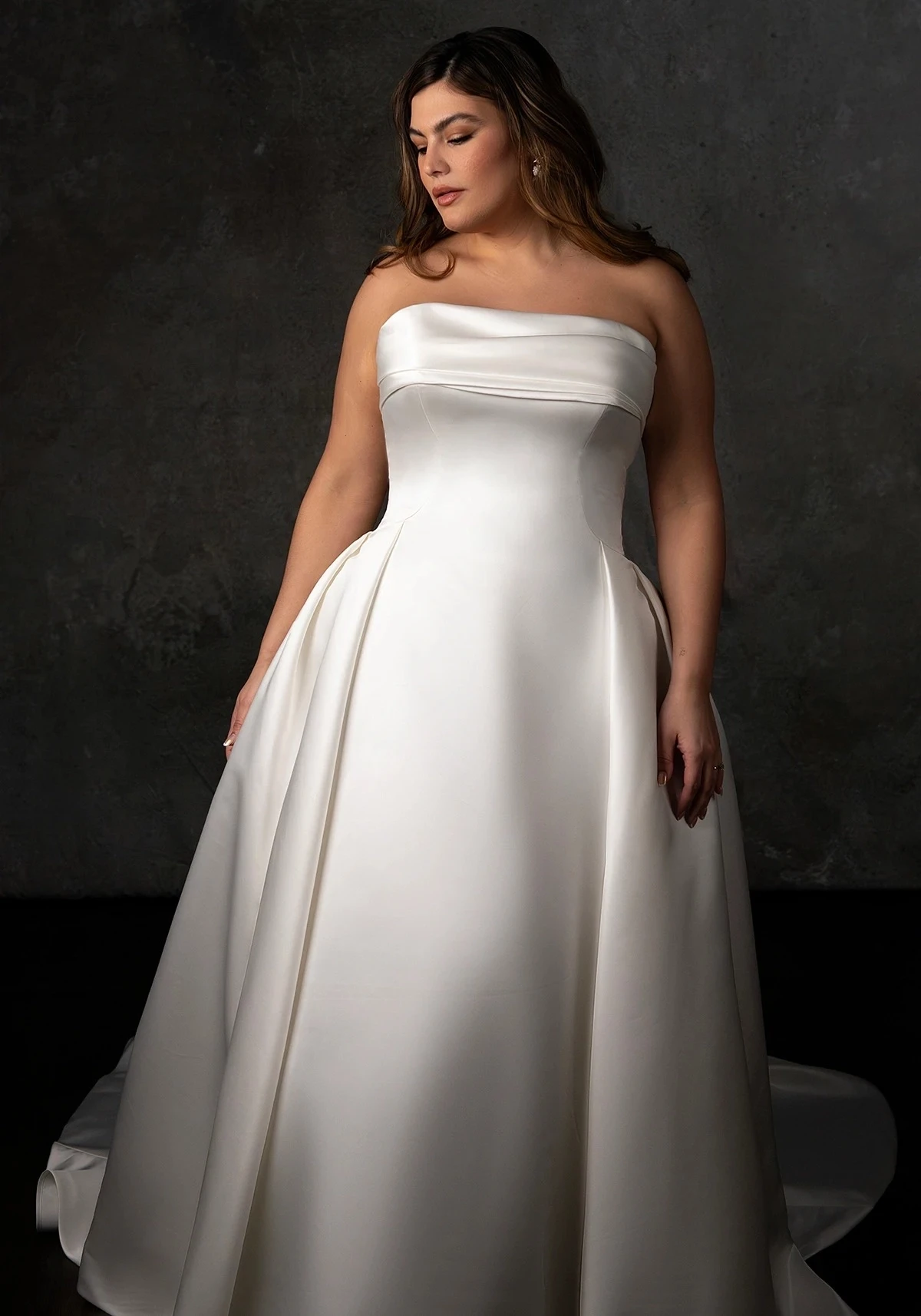 Model wearing white gown