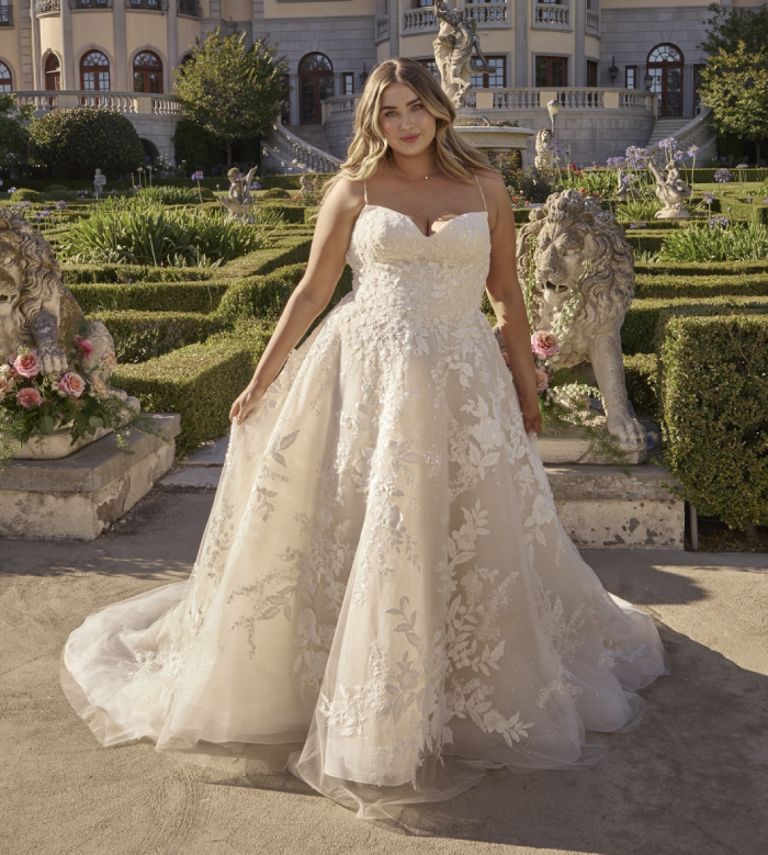 Model wearing white gown