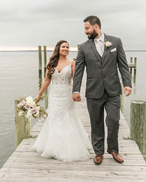 Photo of the real bride and groom near the sea